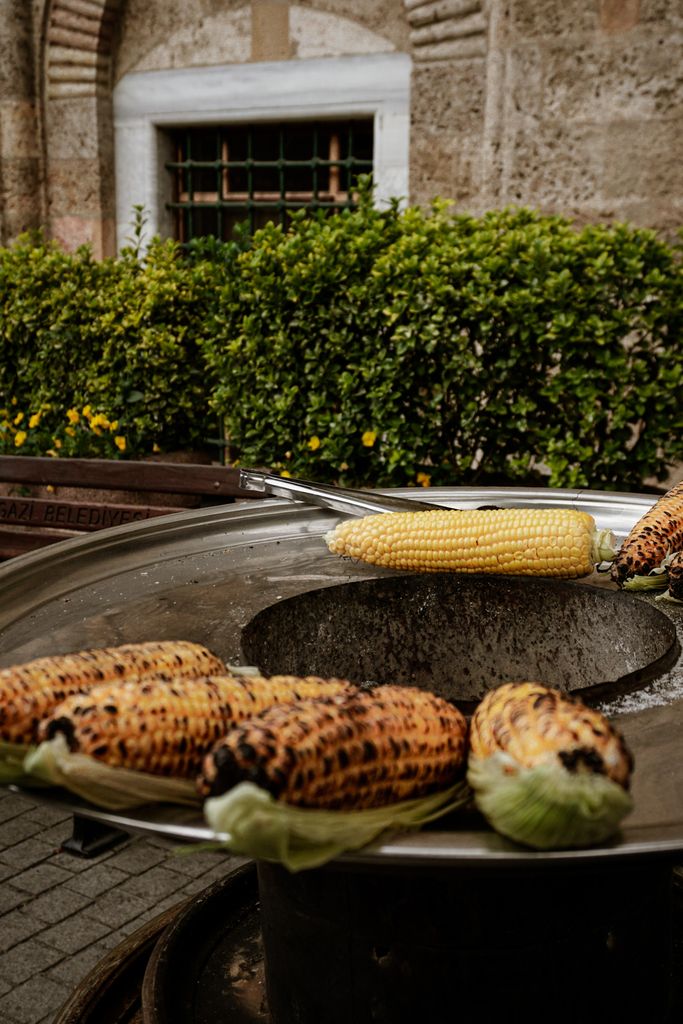Delicious corn on the cob grilled on a street vendor in Turkey, showcasing local flavors.