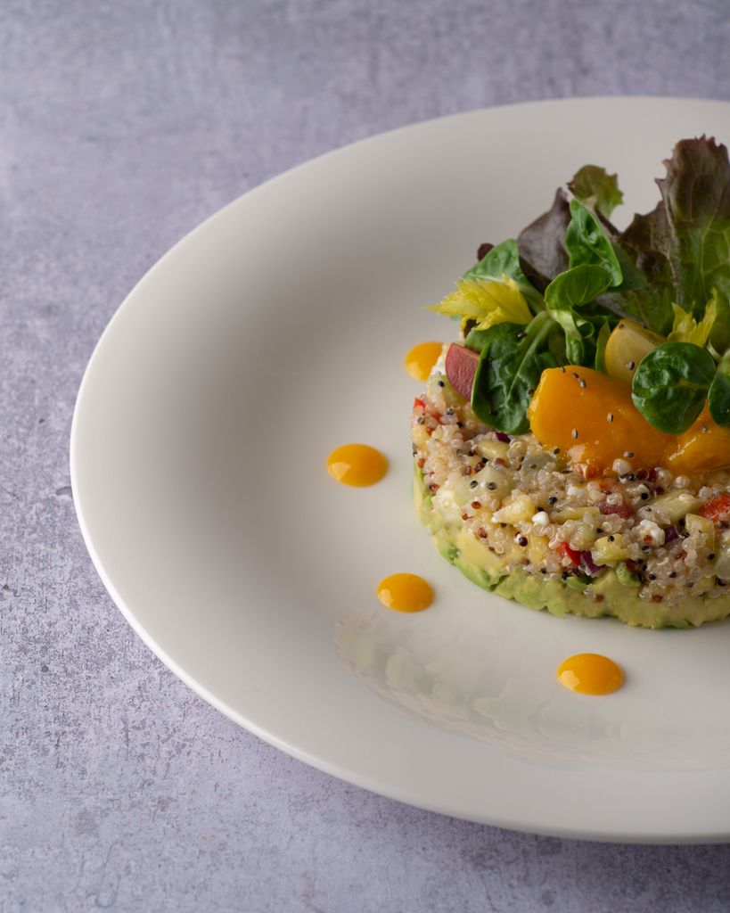Delicious quinoa salad with fresh greens and vegetables, perfect for a healthy meal.