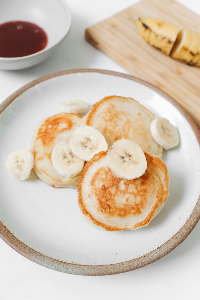 Freshly made banana pancakes on a ceramic plate, perfect for a nutritious breakfast.